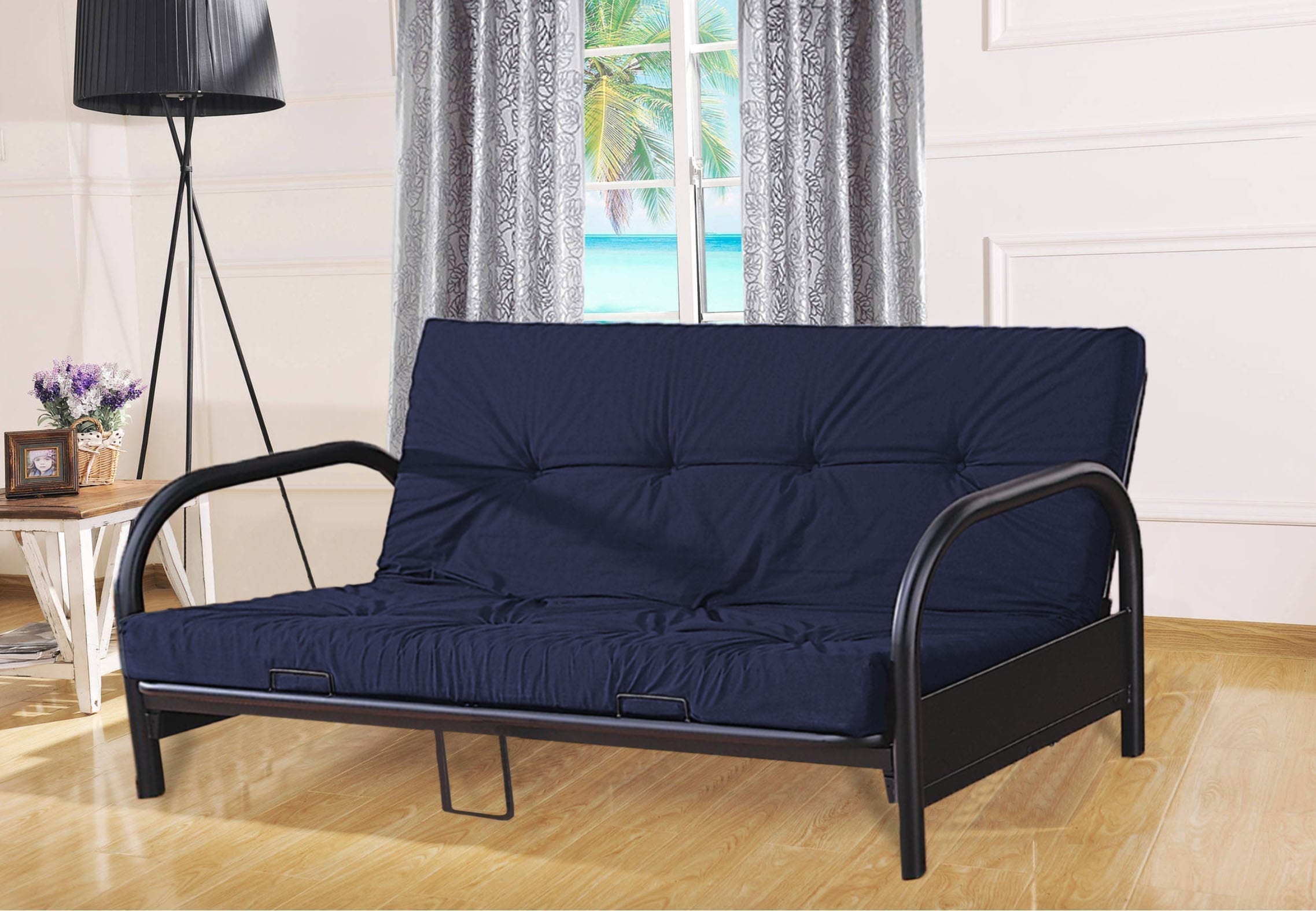 Dark Blue Chair Bed with Black legs in the room