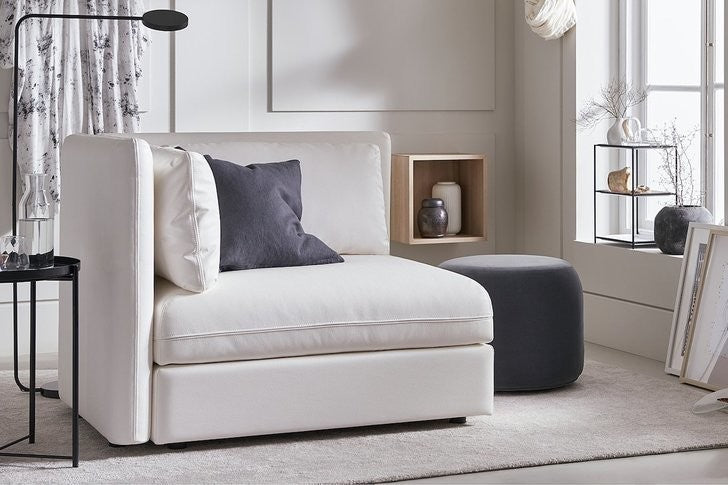 Cream Color Chair Bed in the Bedroom with the stool