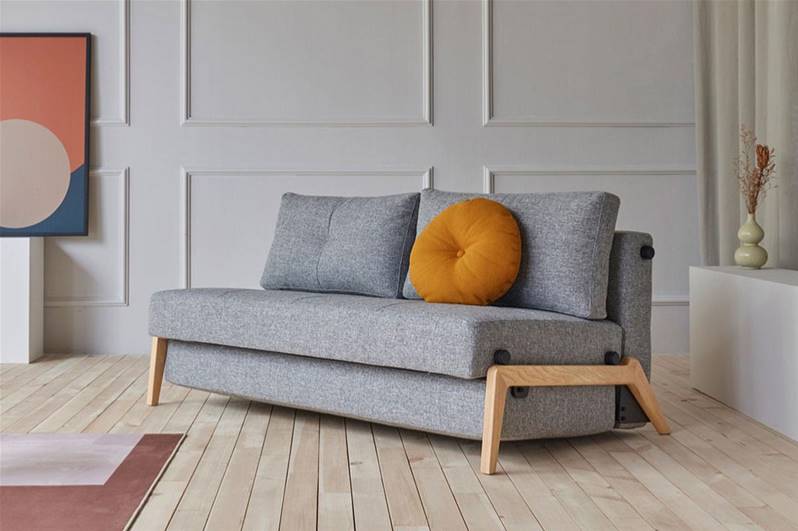 Grey Color Sofa Chair Bed with Orange Pillow on it