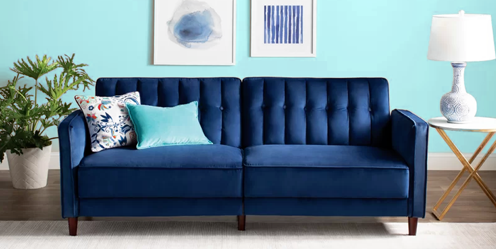 Blue Color Double Sofa Bed with light blue Pillow on it