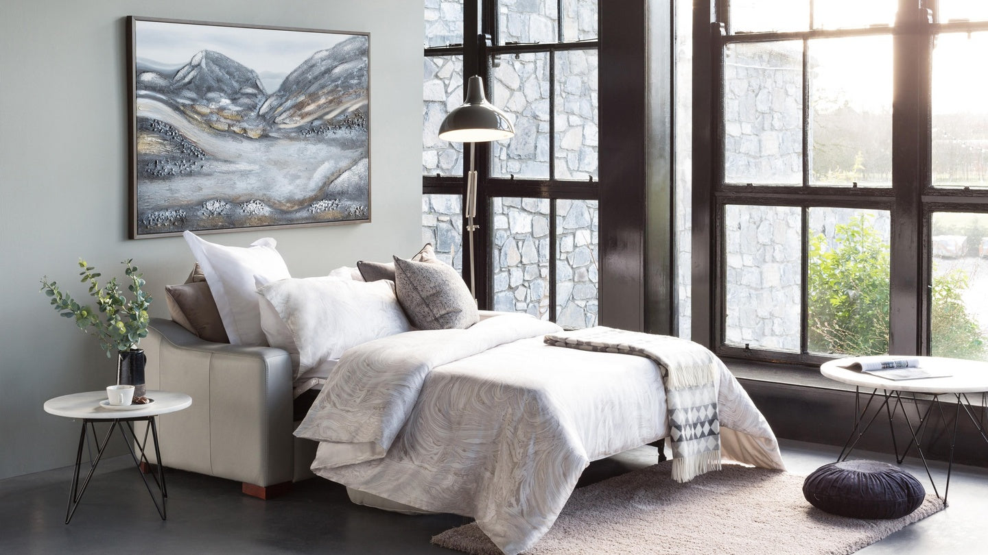 Light Grey Color Chair as a Bed with Blanket on it