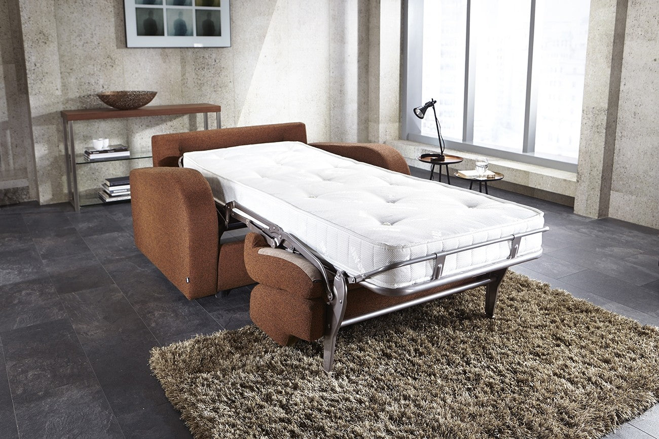 Brown Sofa Chair as a Bed in the Bedroom