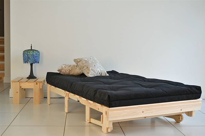 Black and cream color Single Futon chair bed in the bedroom