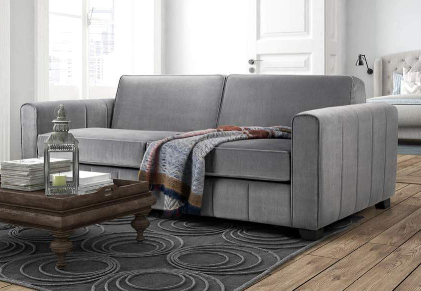 Grey Color Chair Bed with Blanket on it
