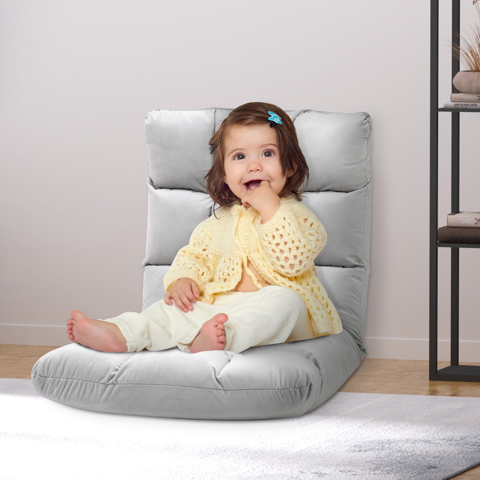 A Baby Sitting on Foah Chair 